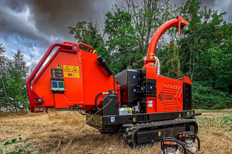 Timberwolf TW 280FTR tracked wood chipper and chainsaws on a Hampshire field after clearance work